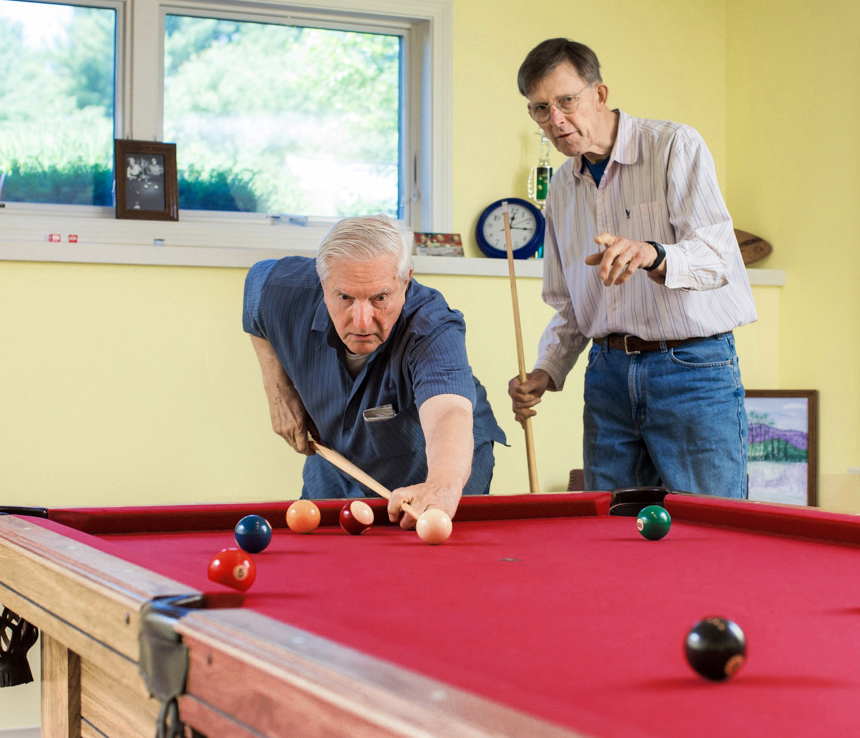 two men playing pool