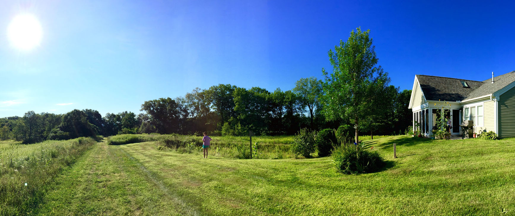 resident looking at back yard field